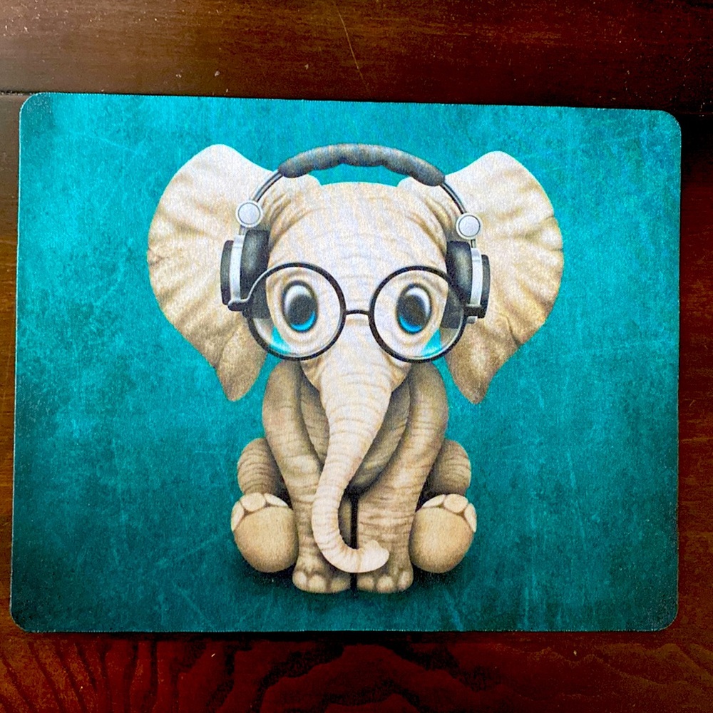 Mouse Pad with elephant measuring 9 3/4 x 8 inches.